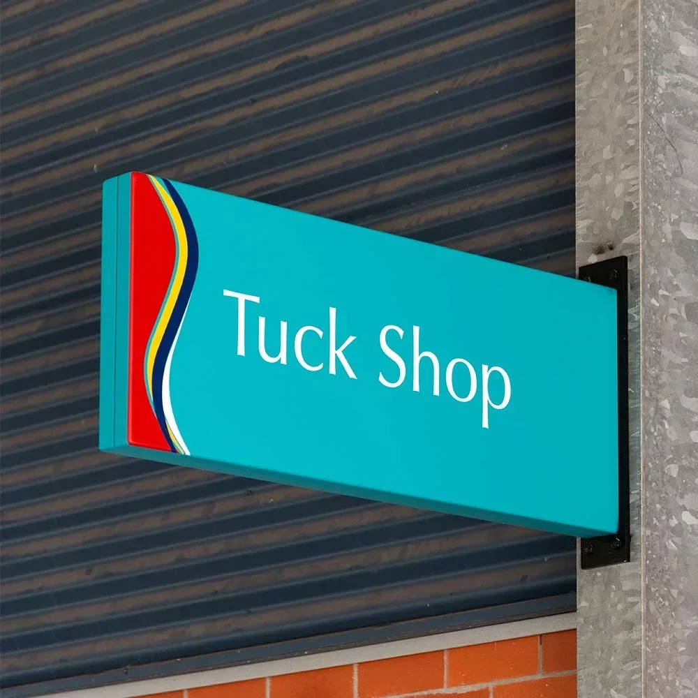 st-augustines-college-tuck-shop-blade-mounted-sign.webp