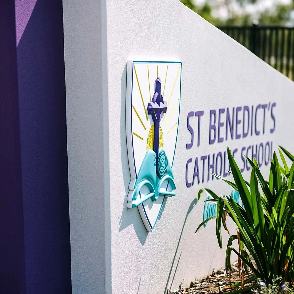 st-benedicts-catholic-primary-school-entrance-monument-sculpted-logo-sign.webp