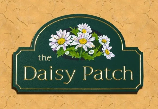 the-daisy-patch-house-sign.webp