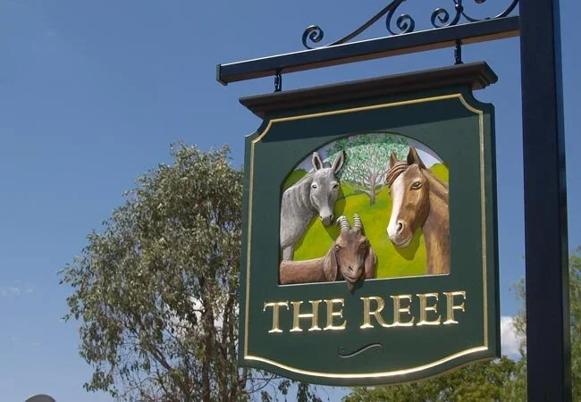 the-reef-property-sign.webp