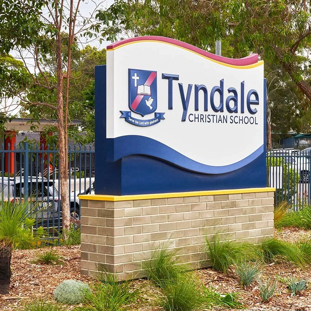 tyndale-christian-school-plinth-mounted-monument-with-faux-brick-base.webp
