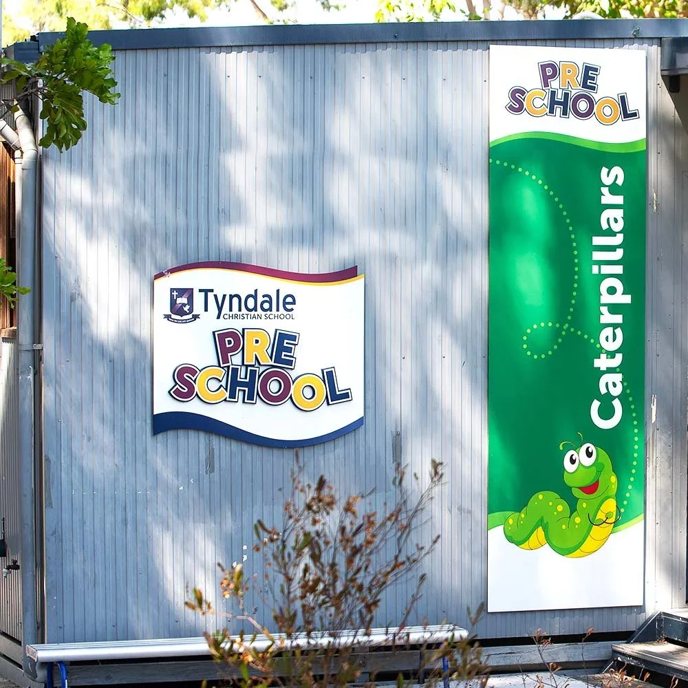 tyndale-christian-school-preschool-building-wall-sign-caterpillars.webp