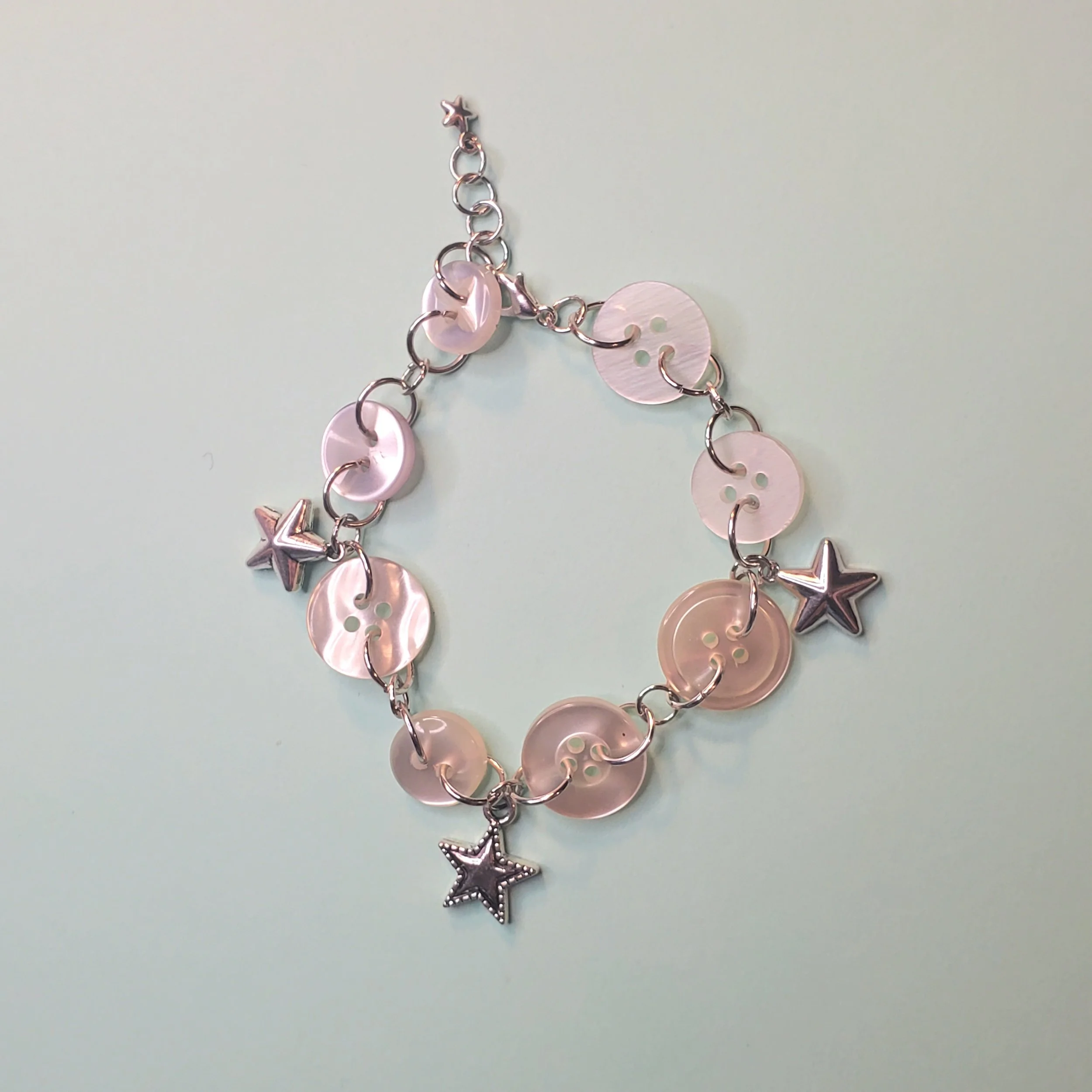 Shiny White Button Bracelet with Star Charms