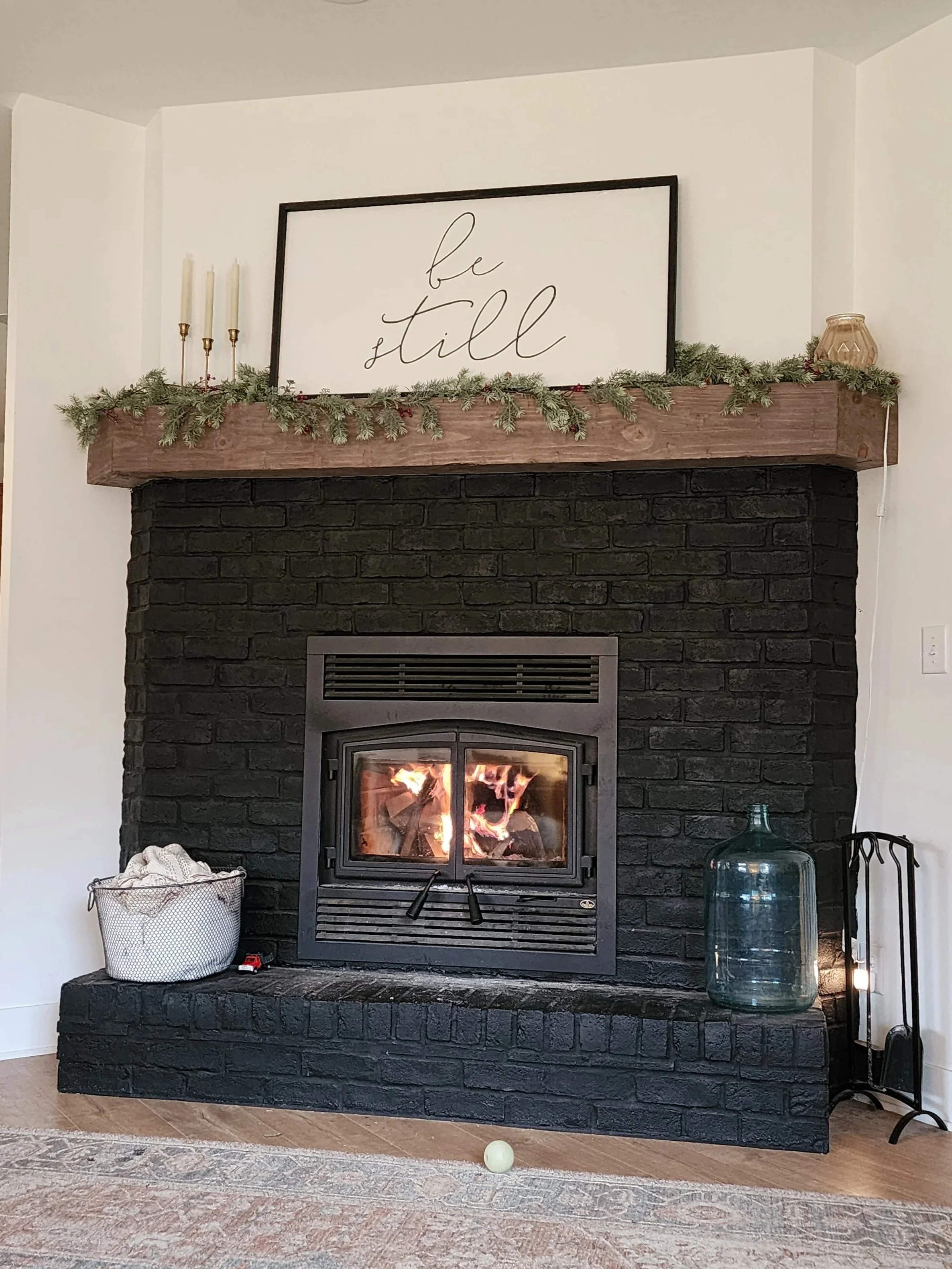 A cozy living room fireplace heating a custom home designed and built by Oakland Construction.