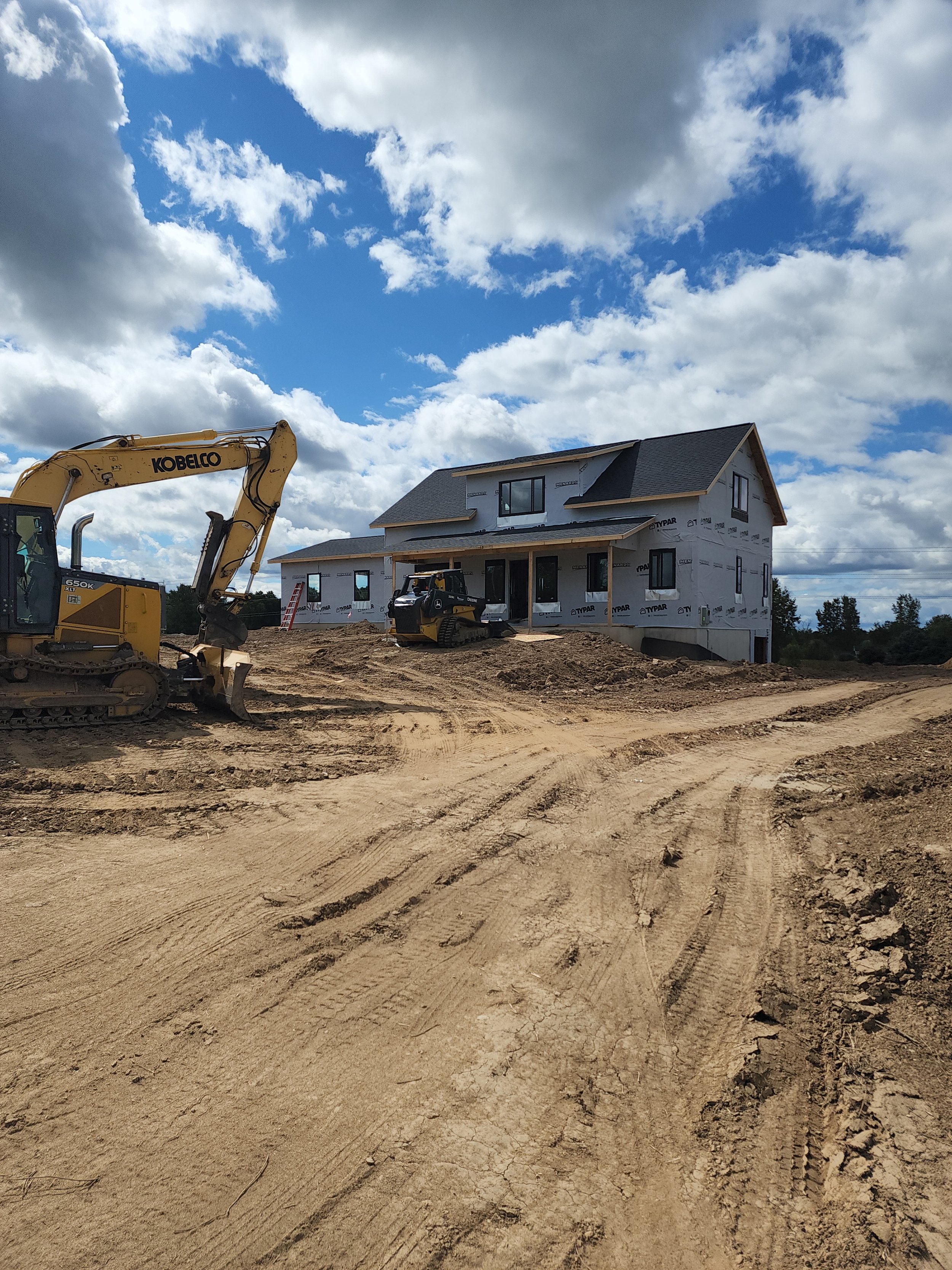 Getting dirt work done before winter on this custom home designed and built by Oakland construction.