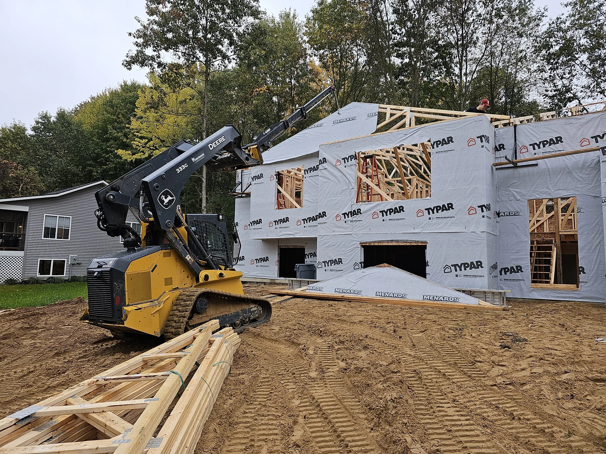 Setting trusses on this home designed and built by Oakland Construction.