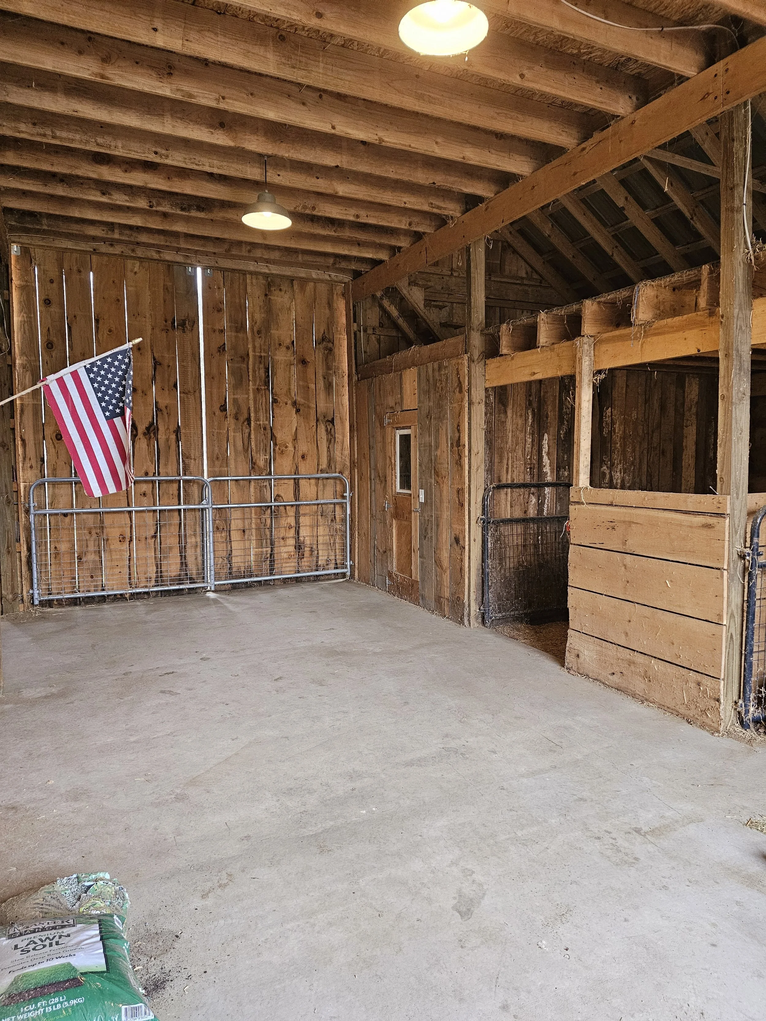 Rough sawn oak stall walls, chicken coop , and an open loft area for easy hay access were favorite features of this barn built by Oakland Construction. And who doesn't love a good breezy barn alley way when the doors are open!