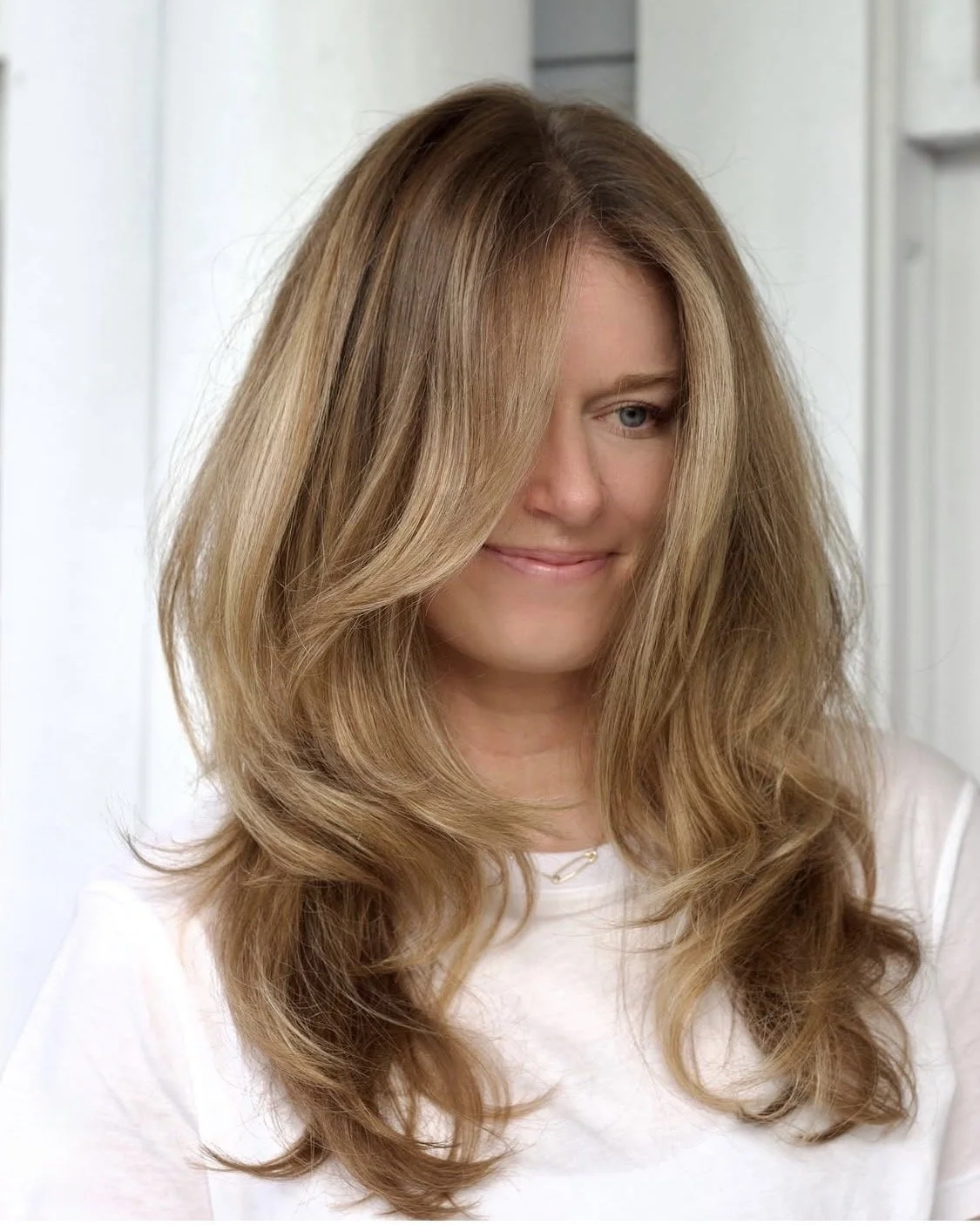Lived in blonde with soft layers by Chelsea Fishburn at Sienna House Austin.