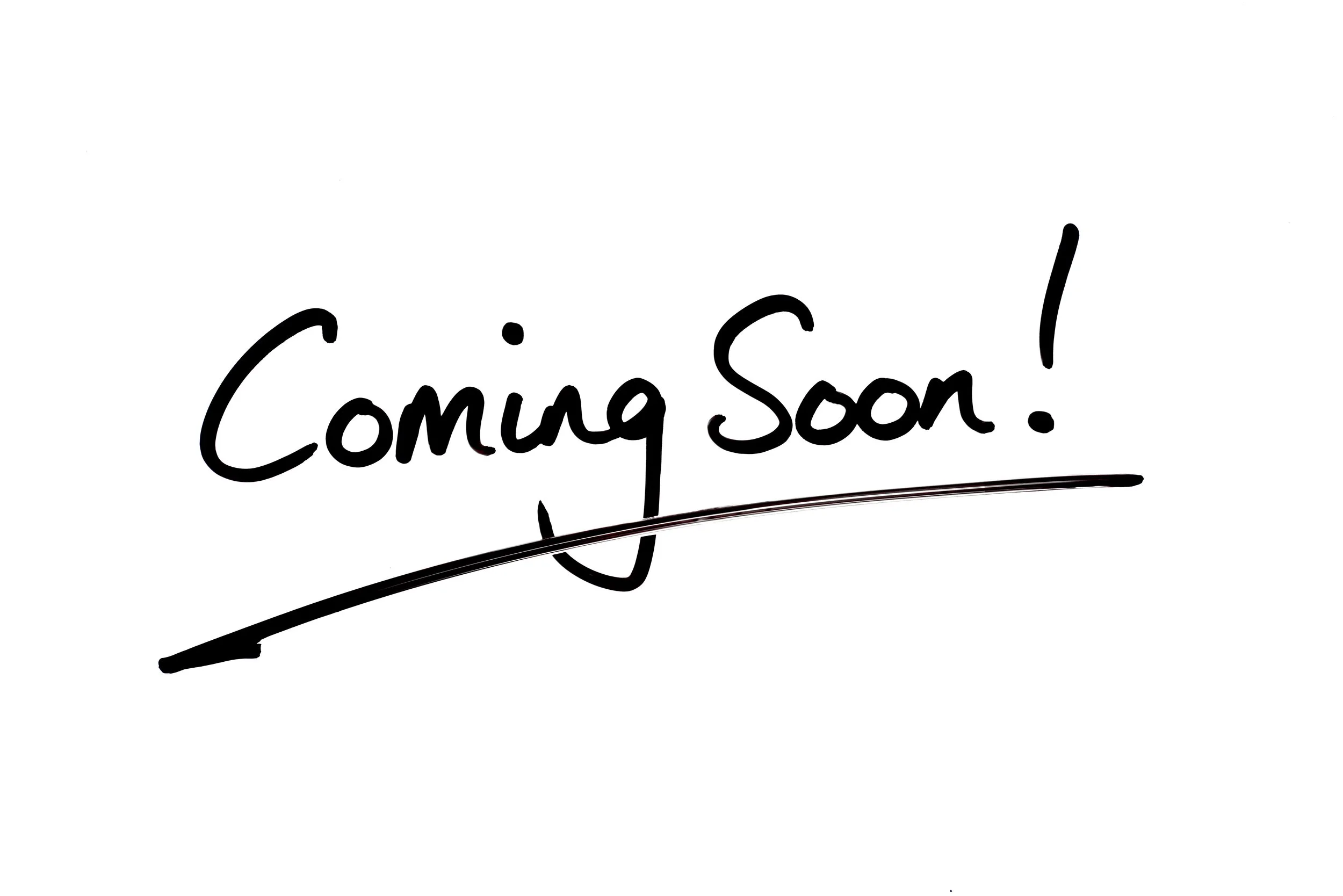 A white background with black handwritten text reading 'Coming Soon!'