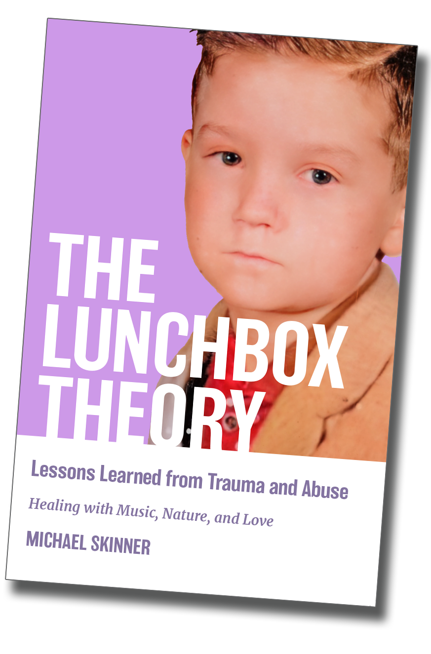 Book cover titled "The Lunchbox Therapy" featuring a young child with a serious expression. The subtitle reads "Lessons Learned from Trauma and Abuse. Healing with Music, Nature, and Love" by Michael Skinner.