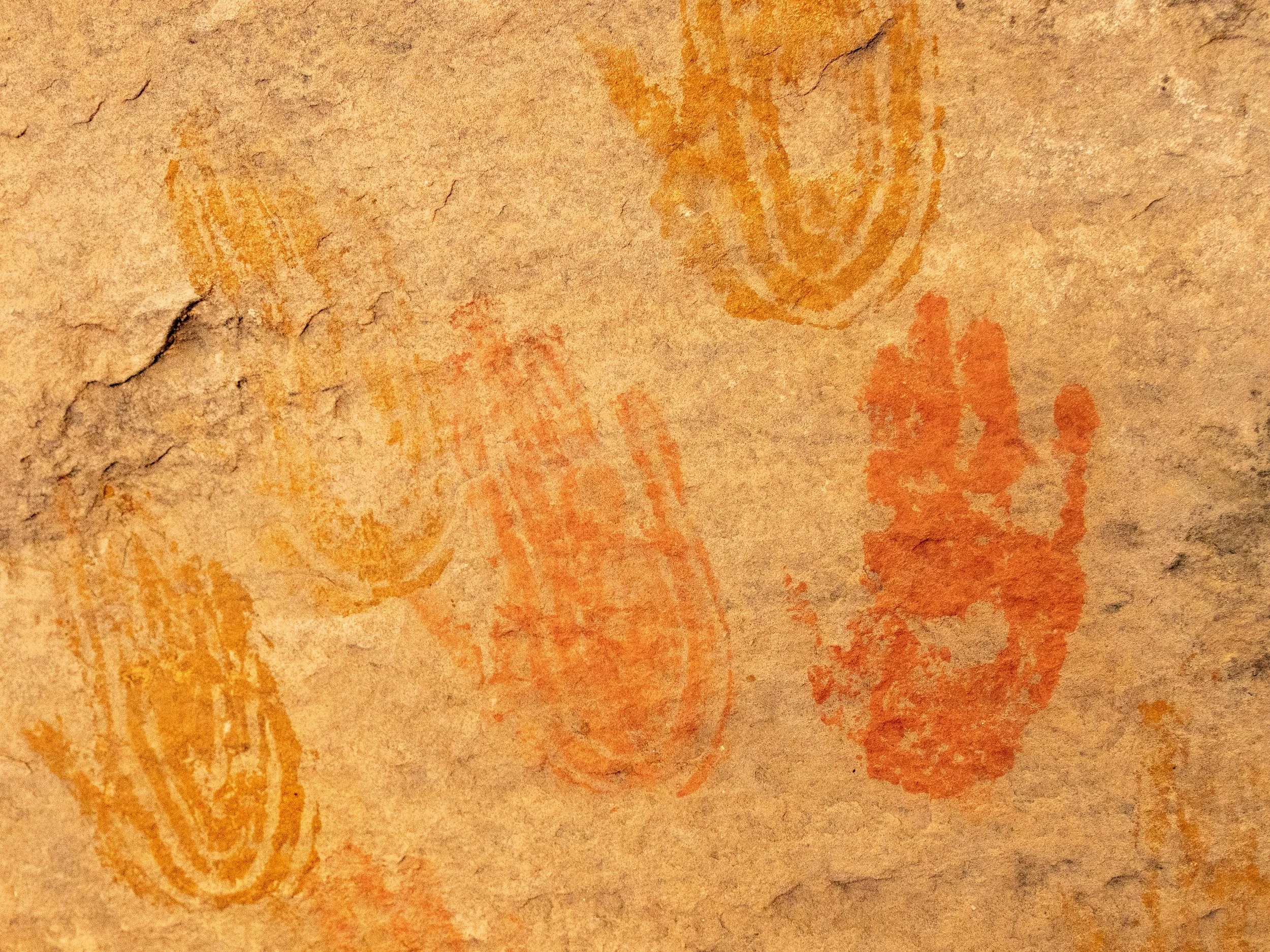 Ancient pictograph handprints on red rock, Utah