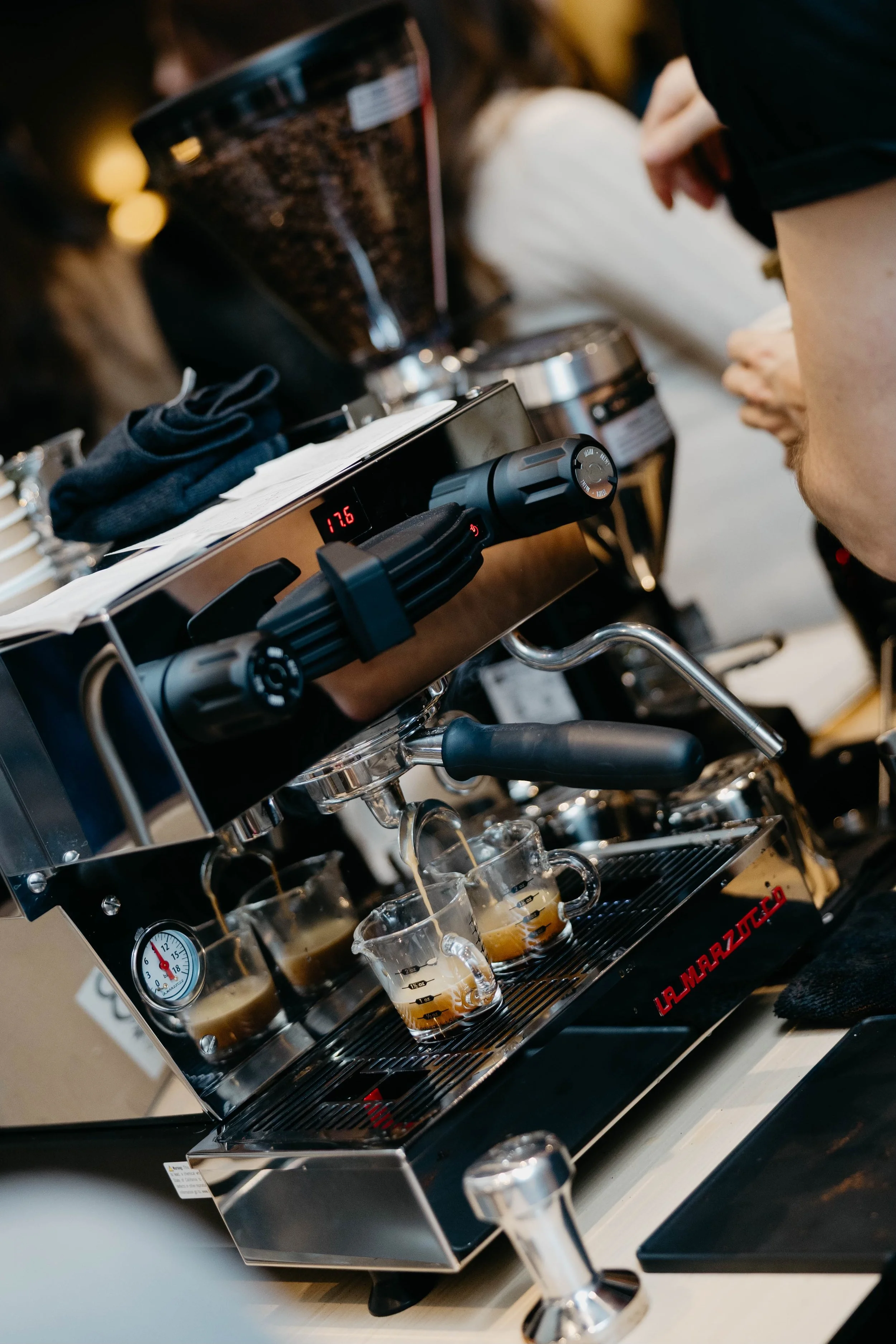 Professional Espresso machine pulling espresso shots on coffee cart at holiday party.
