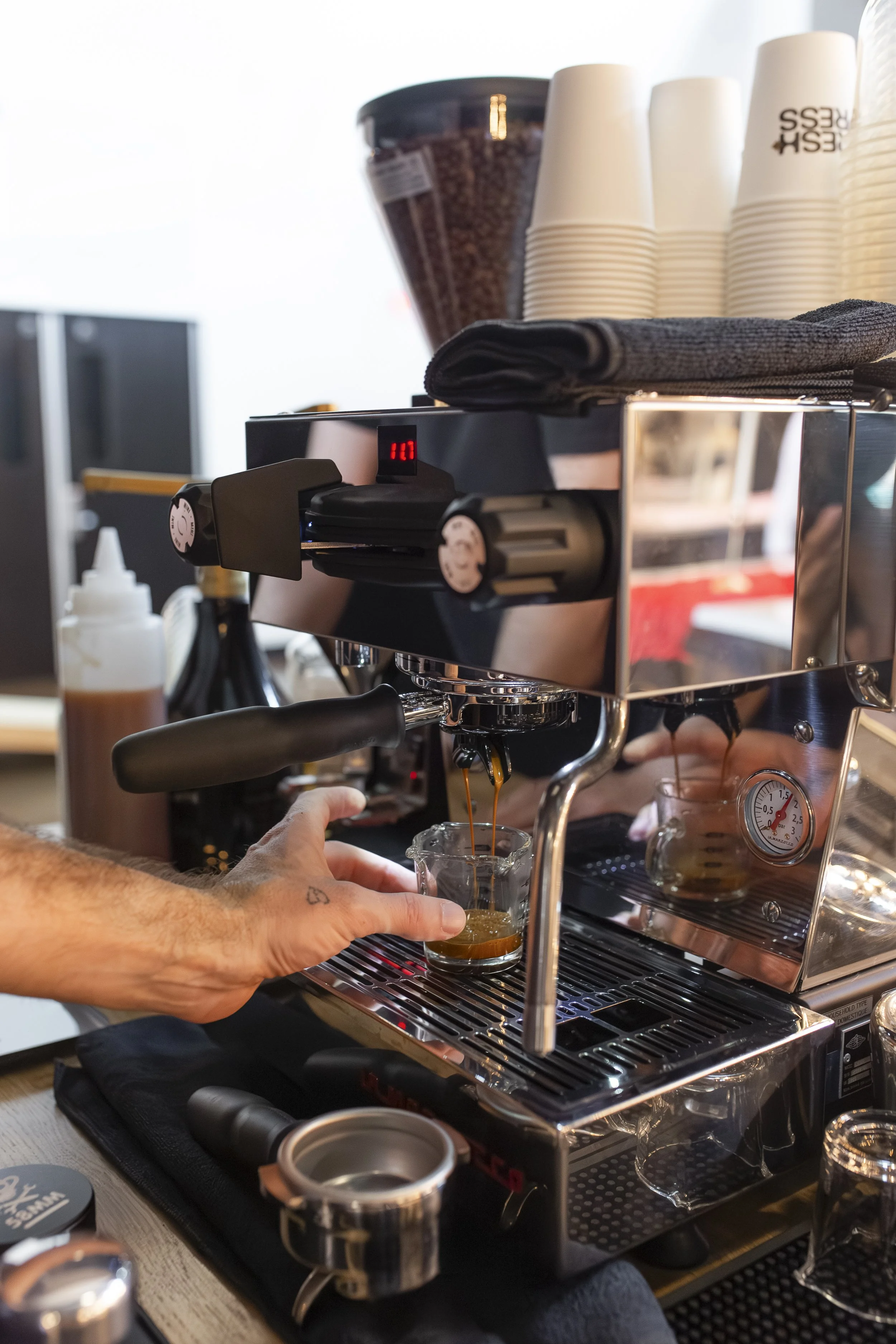 Fresh Press espresso machine on coffee cart pulling shots at wedding.