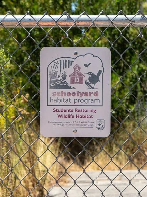 Photo of sign reading Schoolyard habitat program