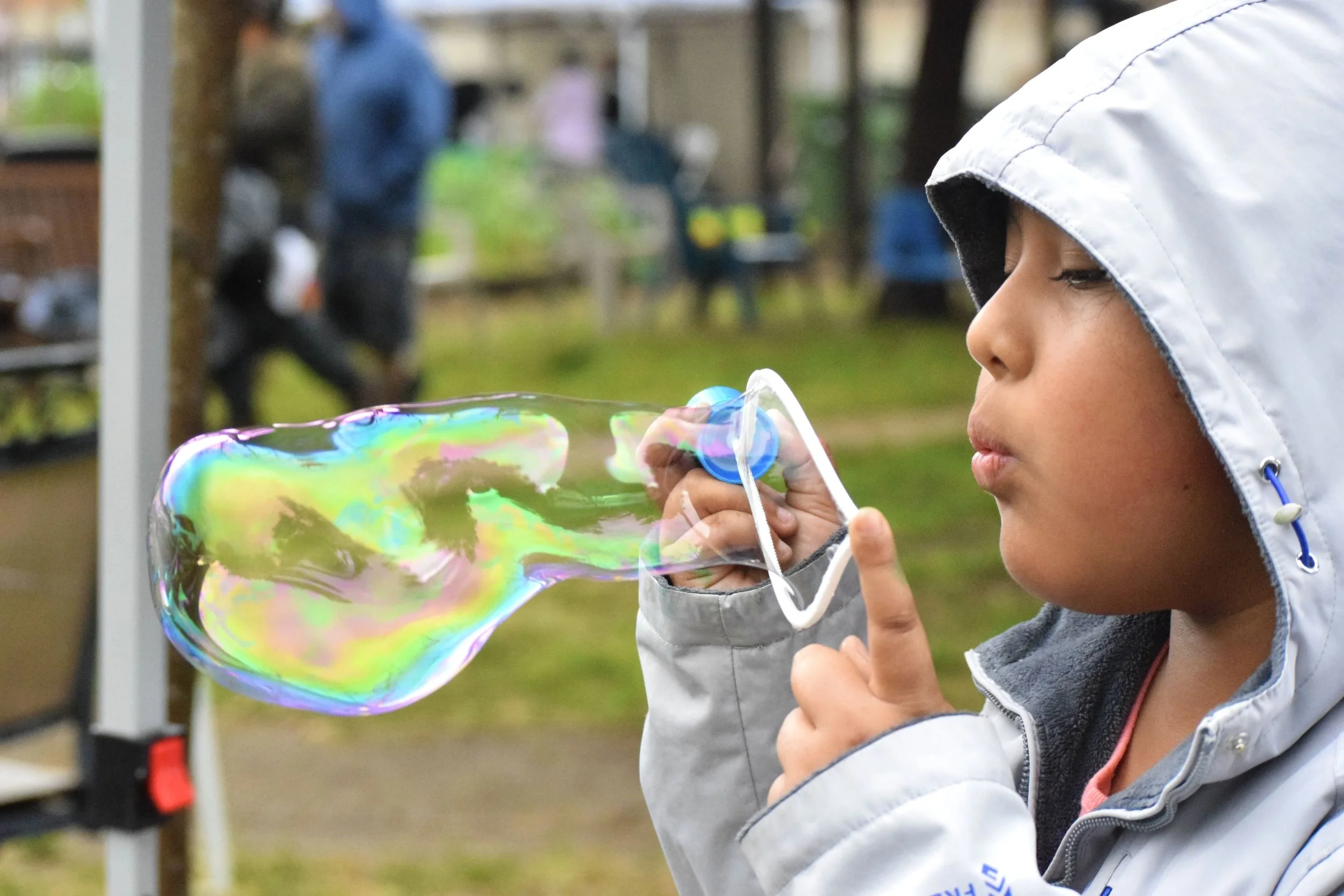 Photo of child blowing bubble