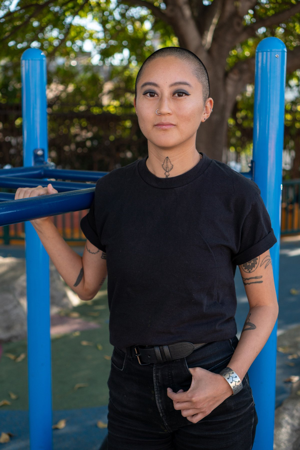 Photo of Bz leaning on playground bars