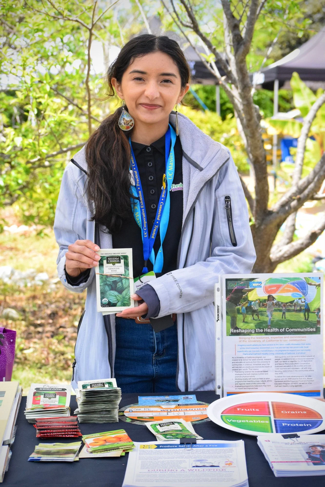 Photo of person holding up seed packets