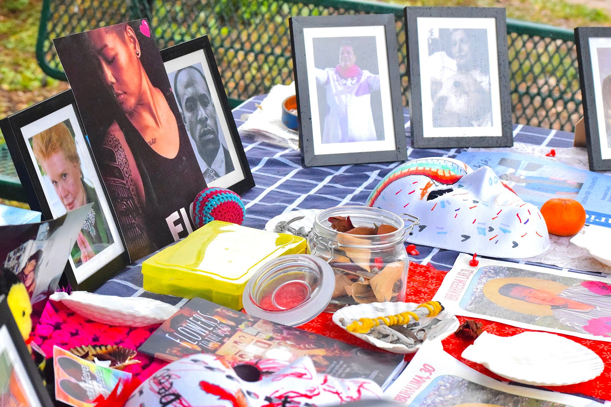 Photo of craft supplies and photos on a blanket