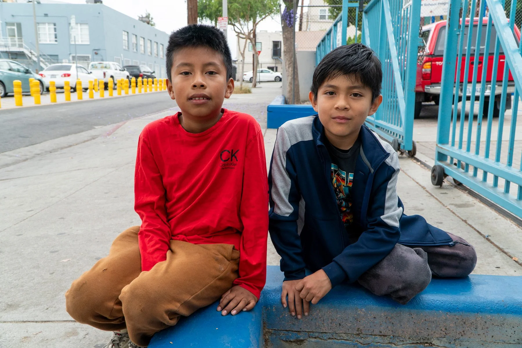Photo of two kids sitting side by side at Esperanza Elementary