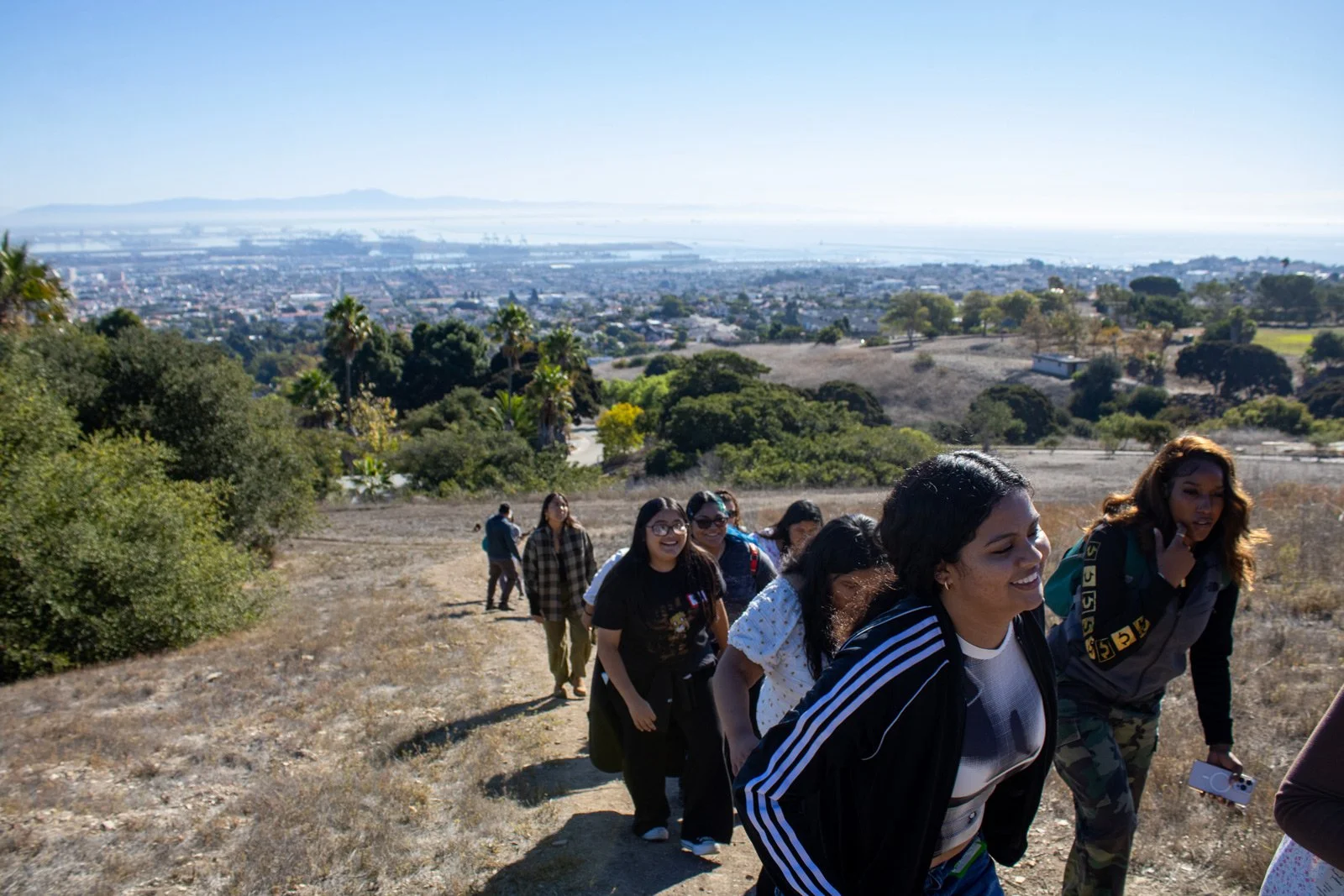 Photo of young people climbing a hill