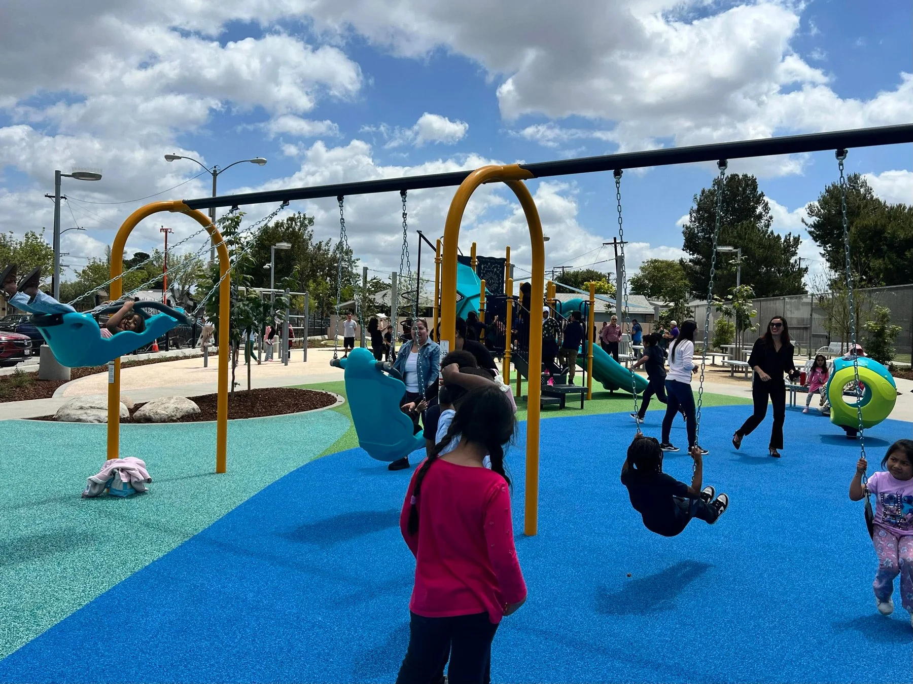 Photo of children playing on the swingset