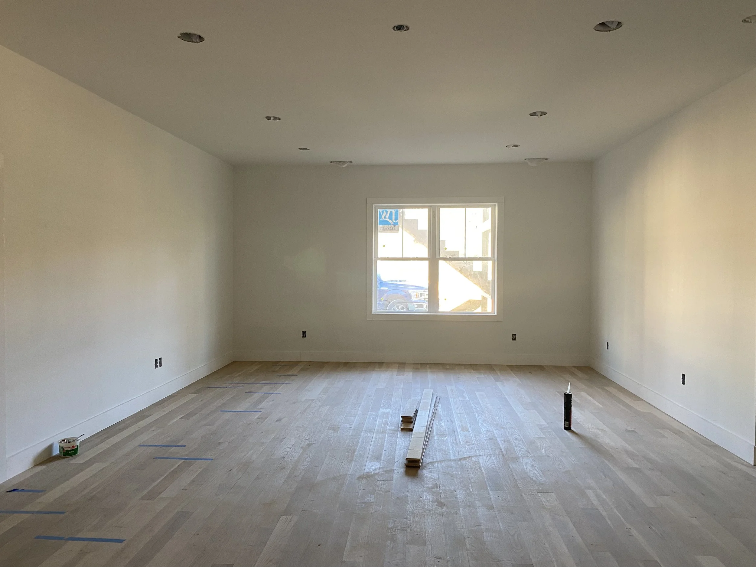 Unfinished hardwood floors in a new home in Leicester, NC by Plumb Level Square builders 