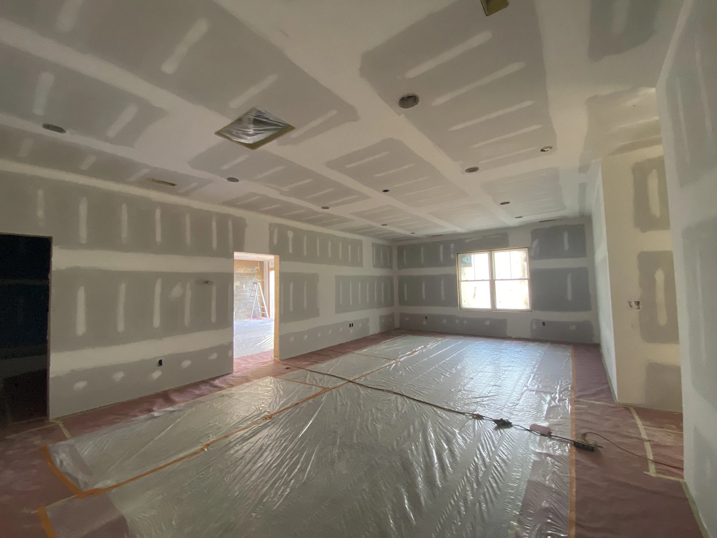 New drywall in a custom home by Plumb Level Square construction in Asheville, NC
