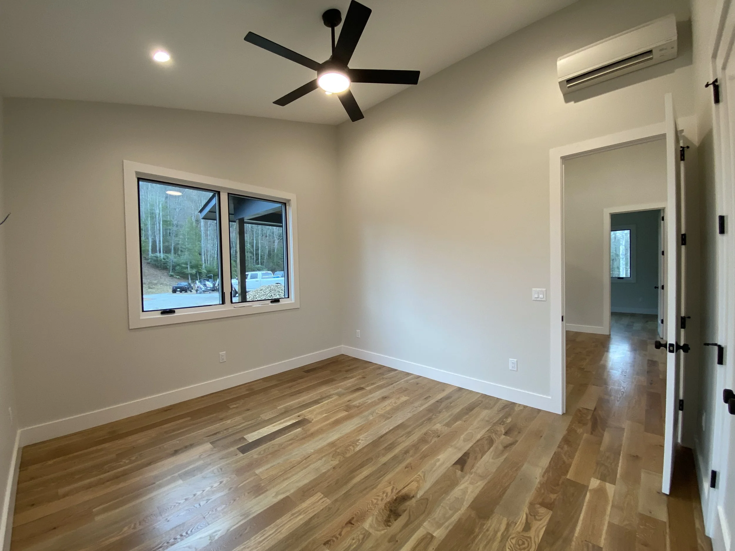 Bedroom in barndominium apartment in Madison County North Carolina built by Plumb Level Square