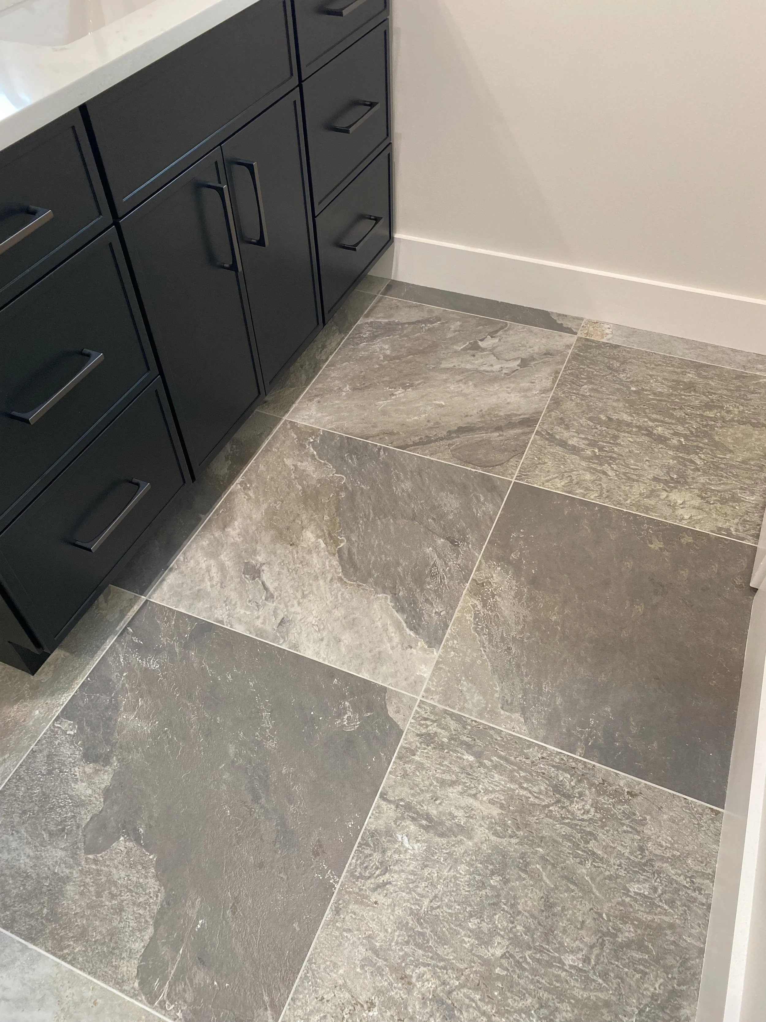 Tile floors in a barndominium apartment in Madison County North Carolina built by Plumb Level Square 