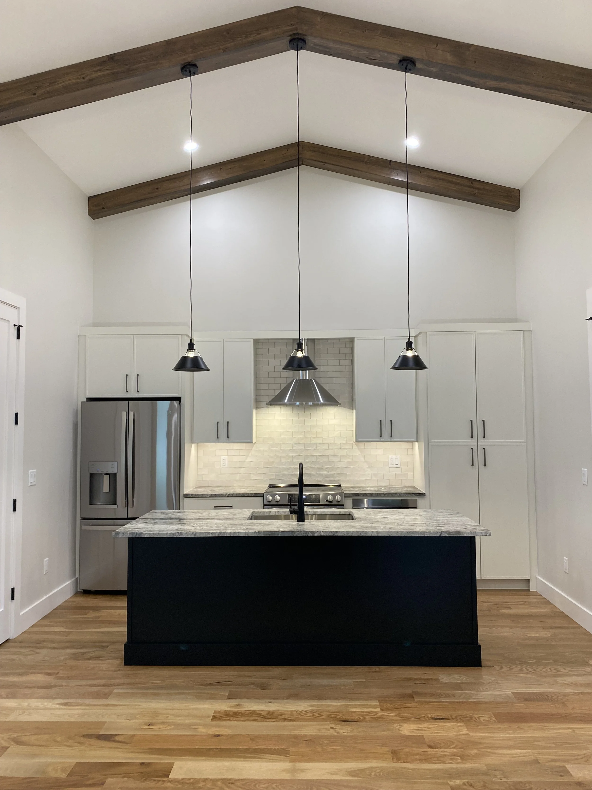 Beautiful modern kitchen in a custom barndominium built by Plumb Level Square in Madison County North Carolina