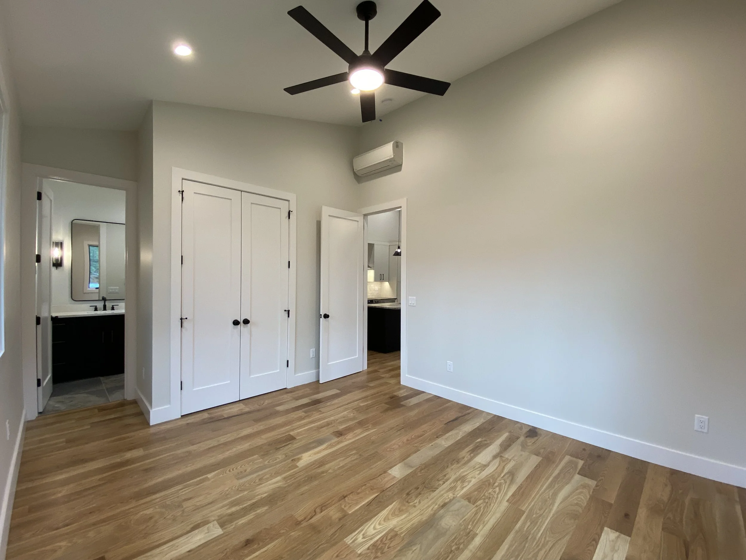Bedroom in barndominium apartment in Madison County North Carolina built by Plumb Level Square