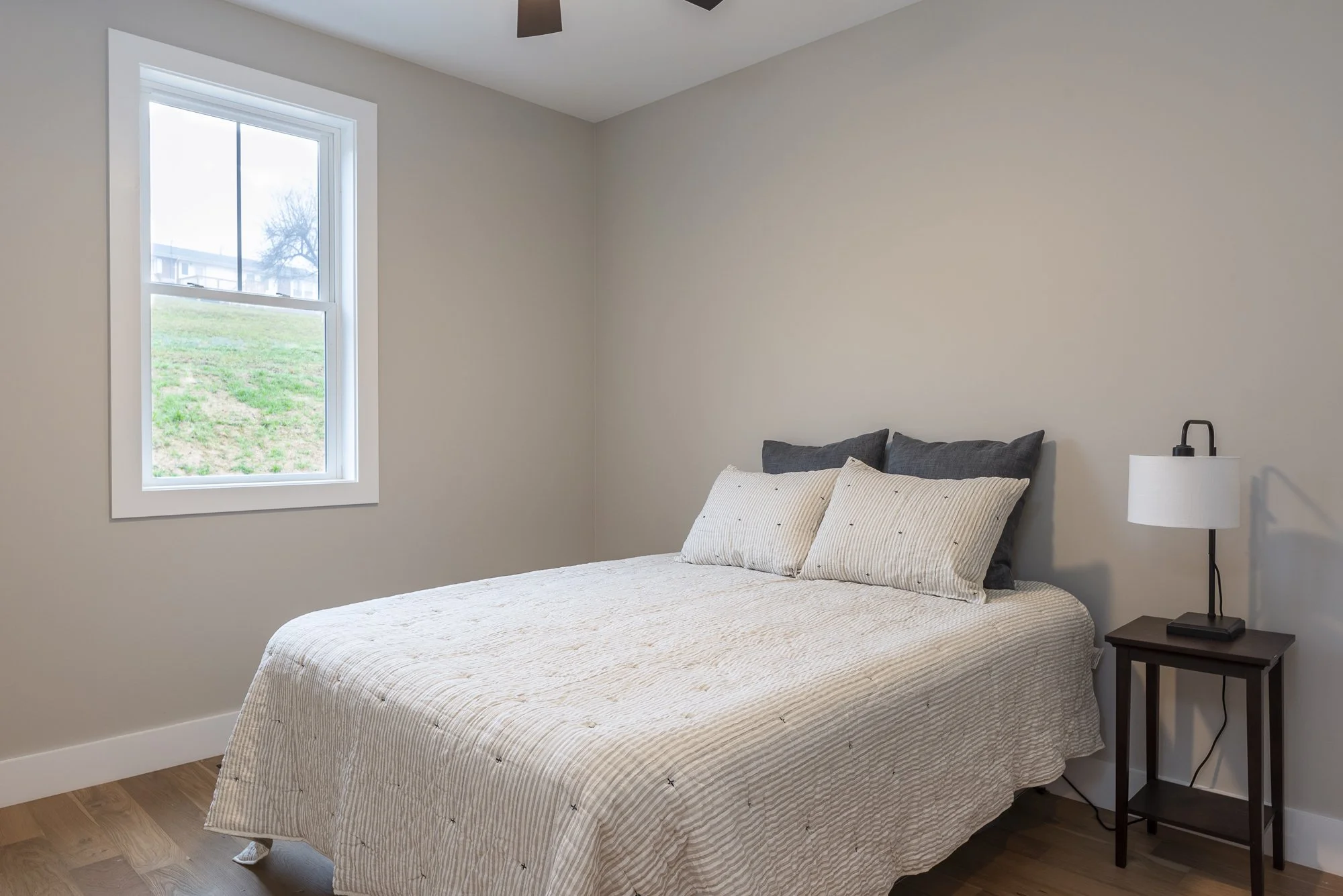 Bedroom in a modern farmhouse constructed by Plumb Level Square builders in western North Carolina