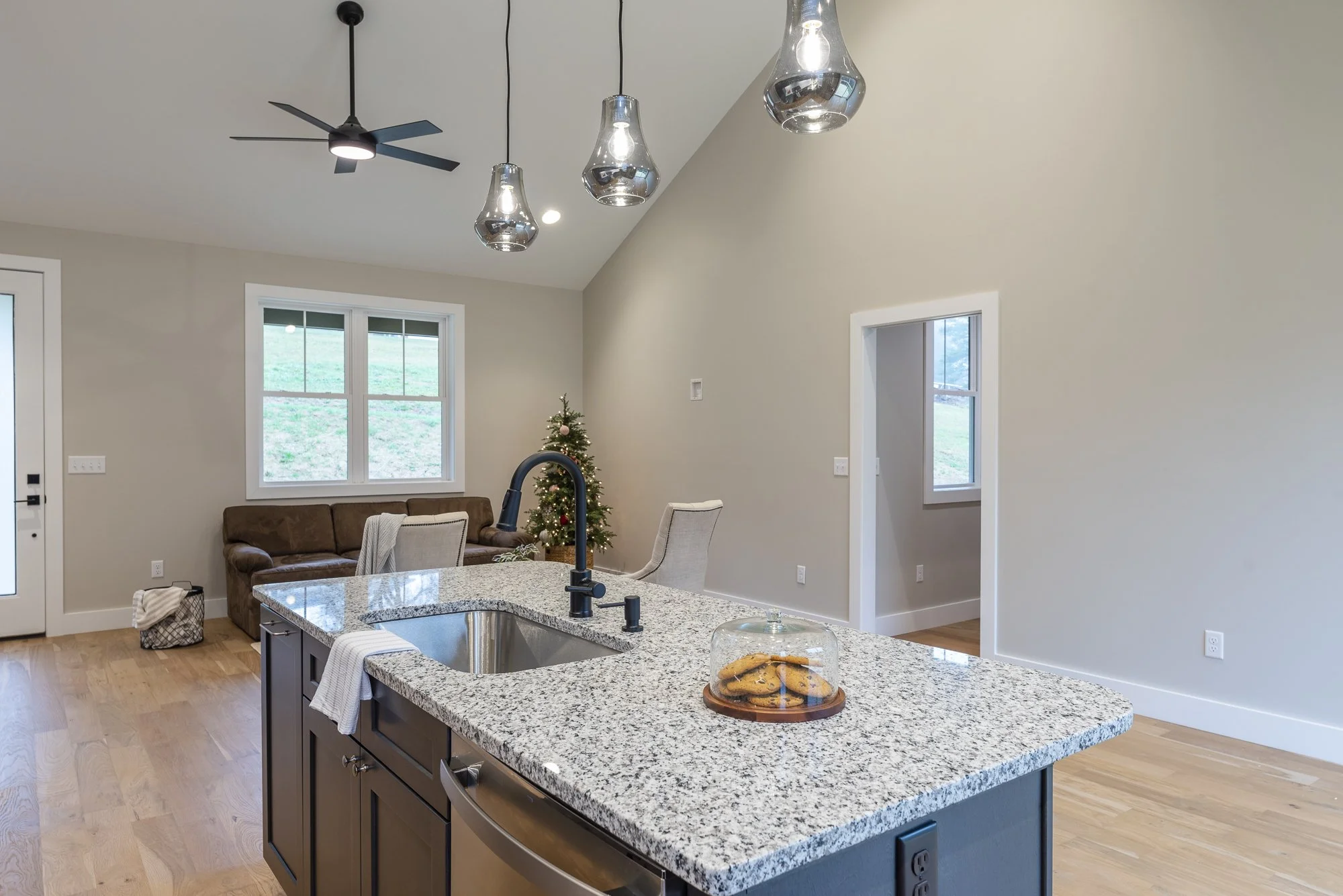 Modern kitchen, living and dining by Plumb Level Square builders in Asheville, NC