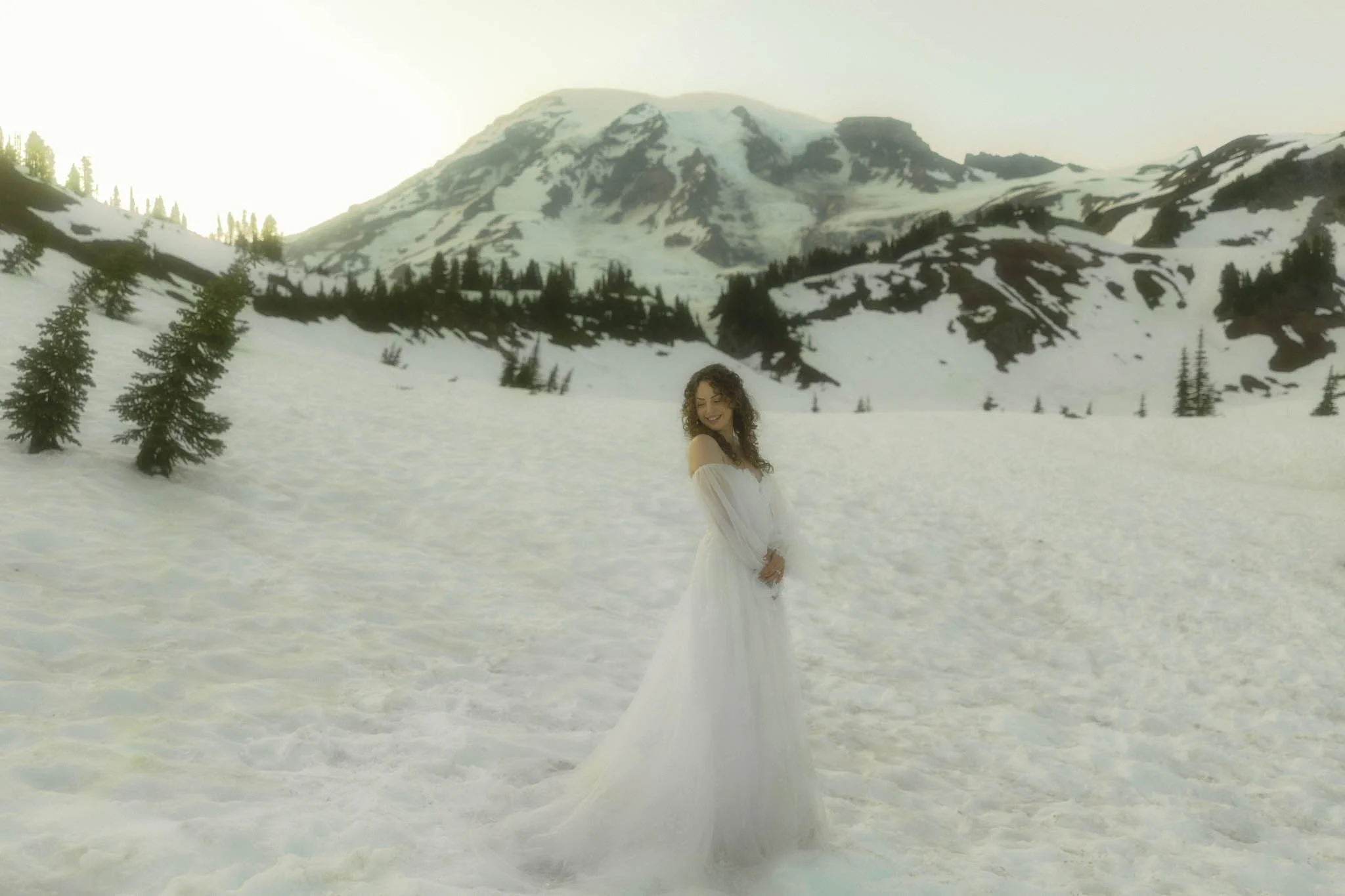 a bride in snowy Mt Rainier on her elopement day