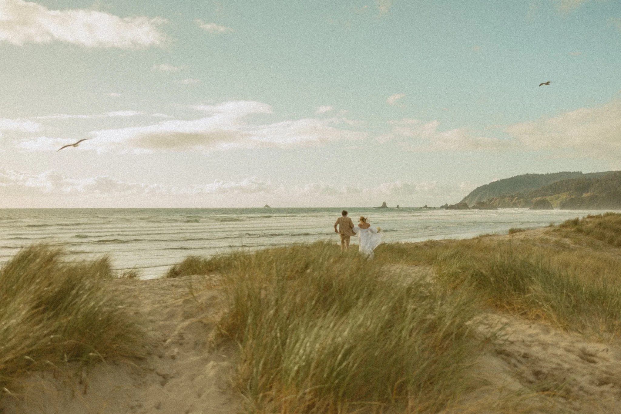 couple eloping on Cannon Beach in Oregon