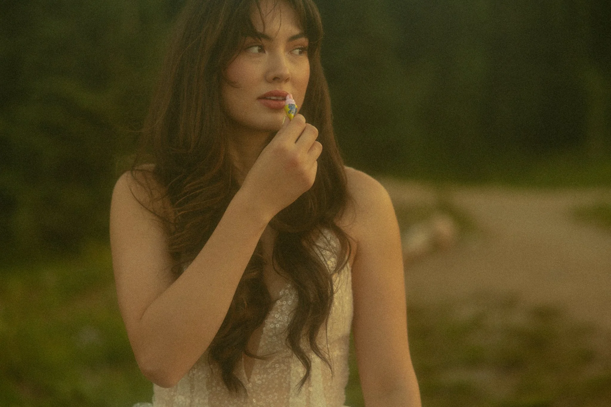 bride applying lip gloss before her adventure elopement