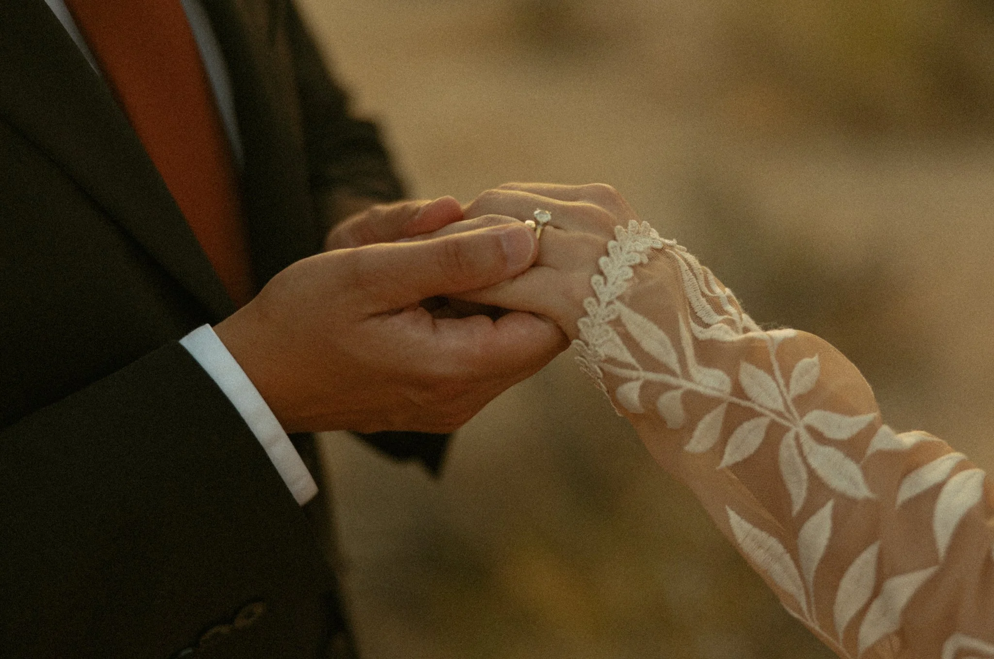 a couple exchanging their rings during their elopement ceremony in California's Joshua Tree National Park