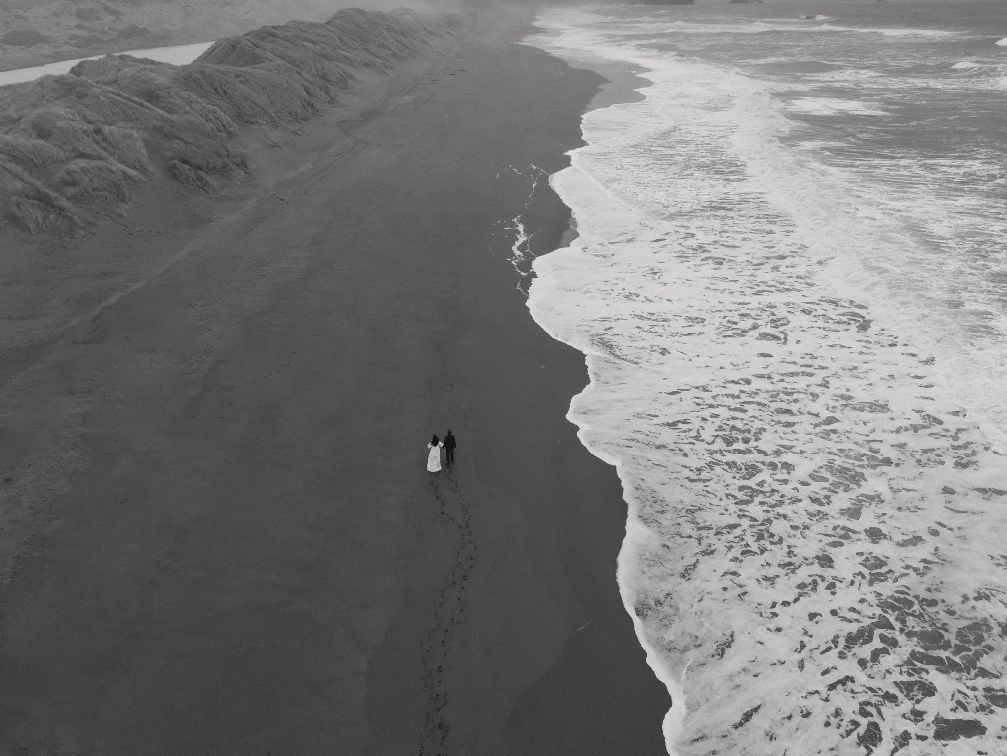 a couple getting married along the moody Oregon Coast