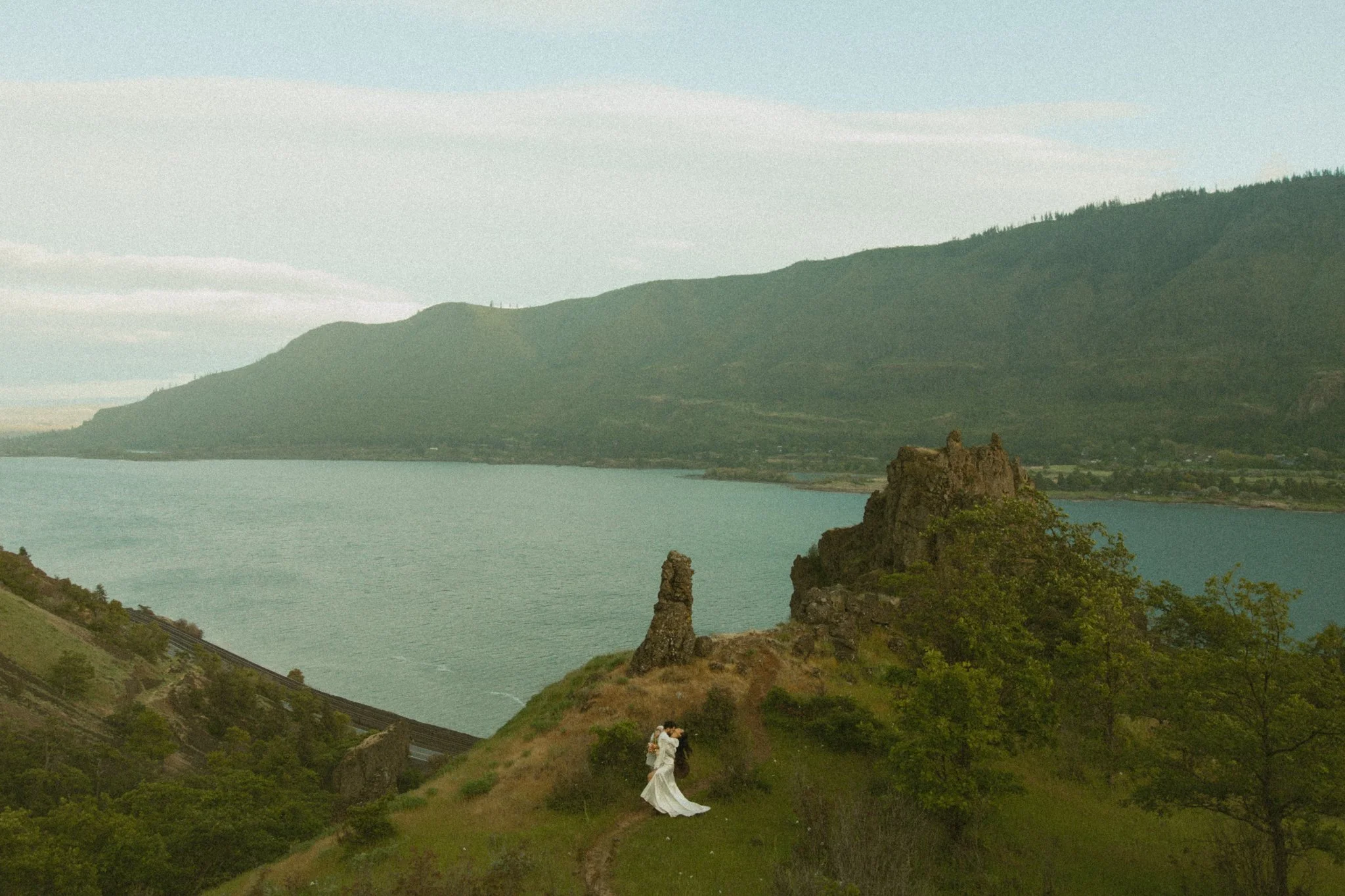 a couple eloping along the Columbia River Gorge overlooking the river