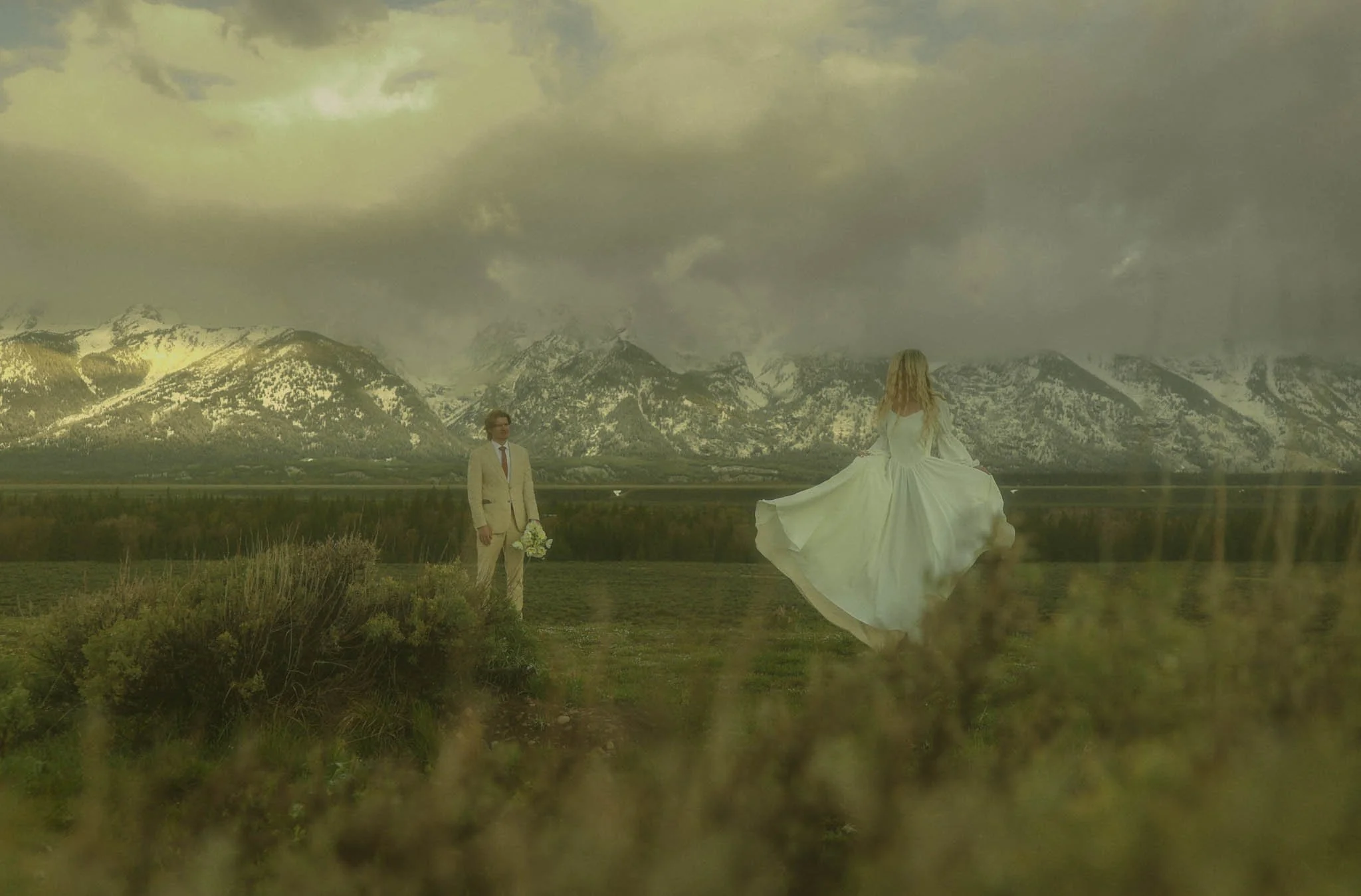 a couple eloping in the Grand Tetons at sunrise in mid May