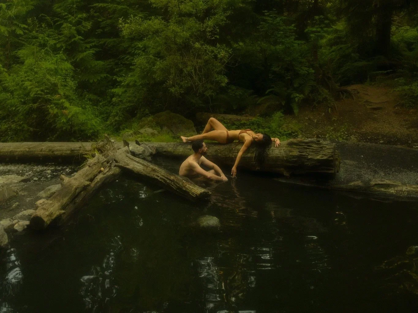 an elopement couple relaxing in a hot spring in the North Cascades