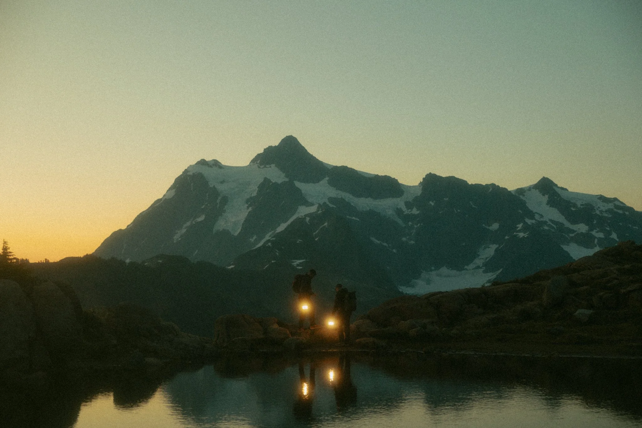 elopement couple hiking to their ceremony spot in Washington's North Cascades