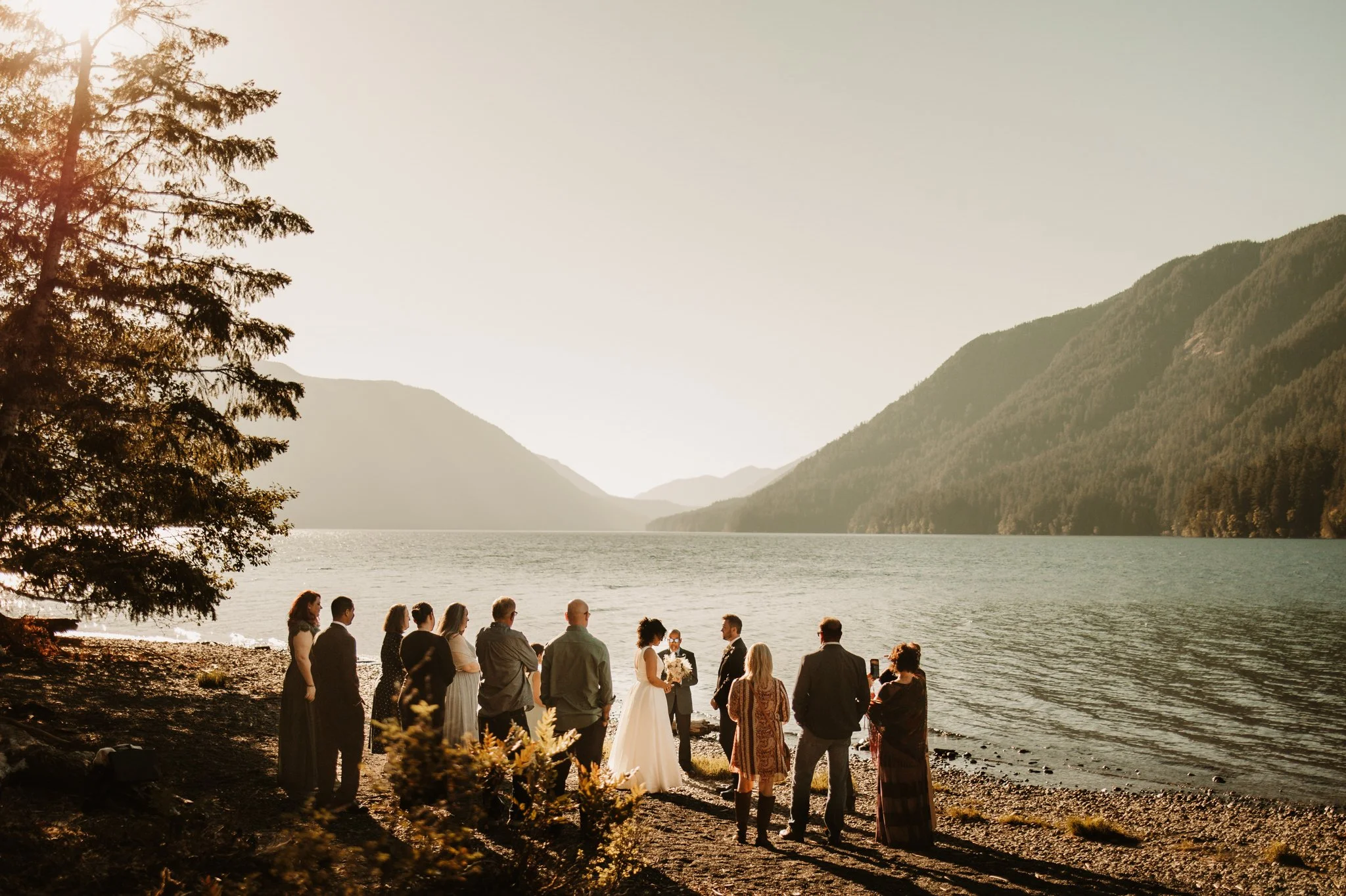 couple eloping on shore of Lake Crescent in Olympic National Park