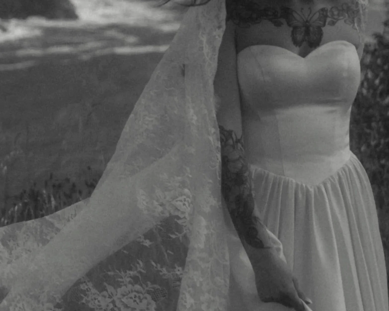 black and white detail photo of bride in her dress