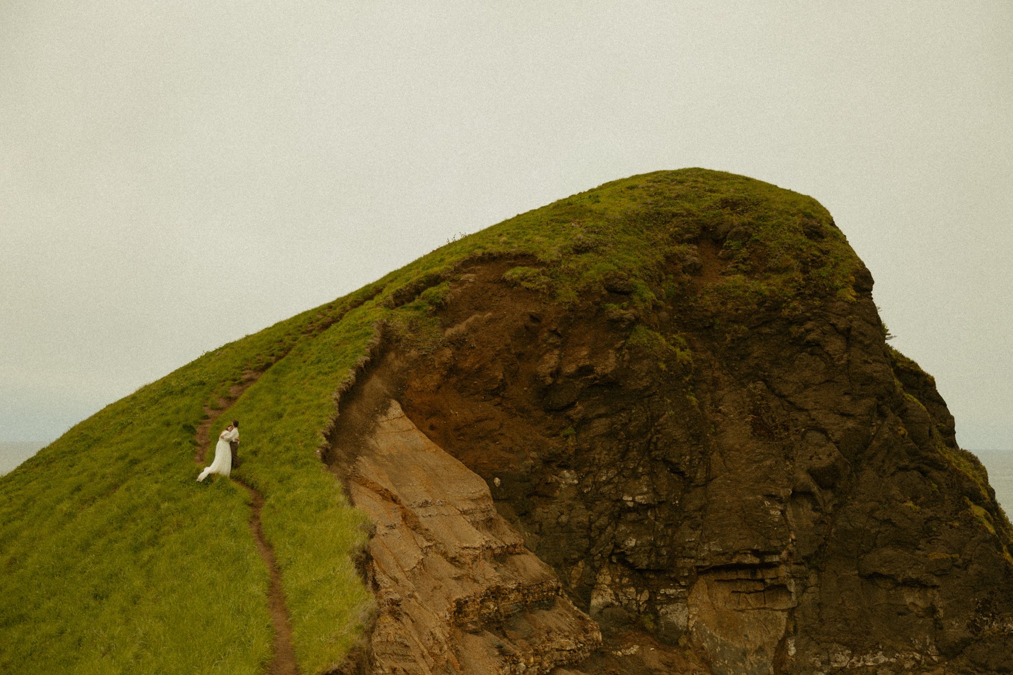 elopement couple hugging on hiking trail