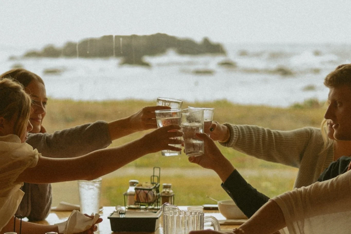 guests cheersing at post-elopement dinner celebration