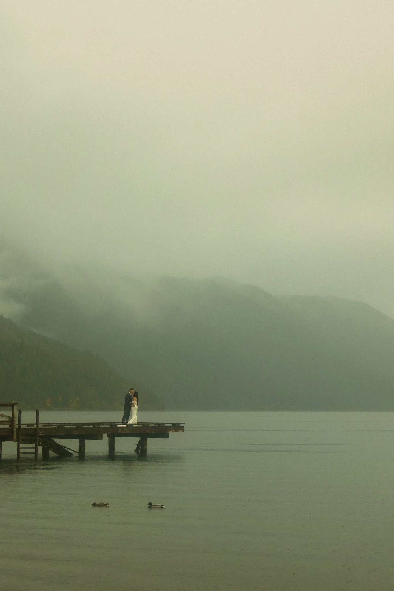  an elopement couple getting married in Olympic National Park on a rainy fall day 