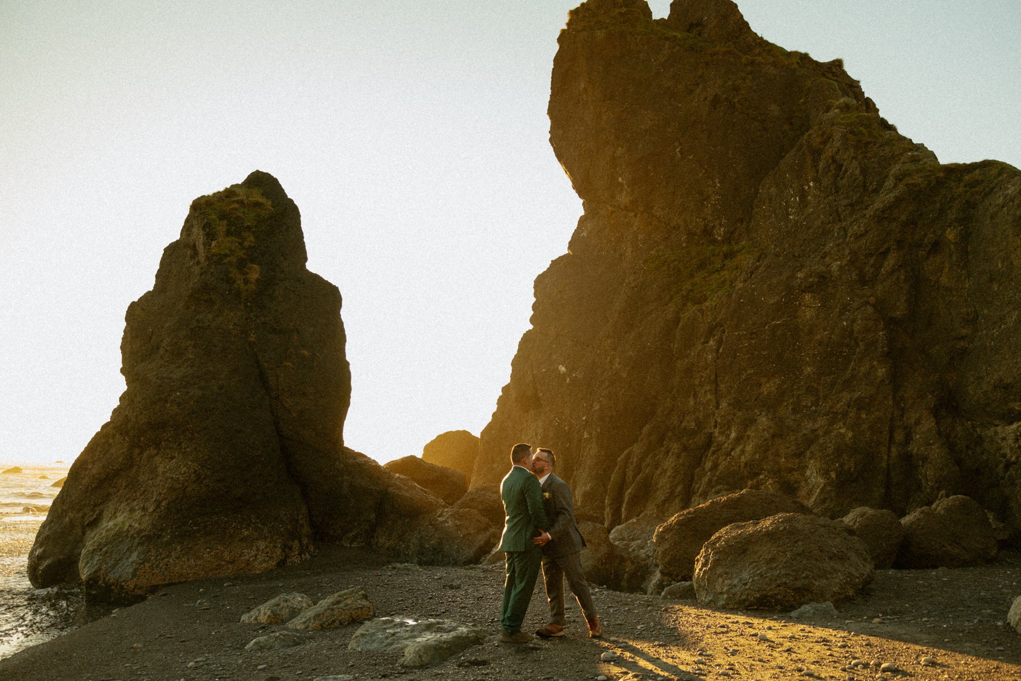 LGBTQ elopement couple kissing on the Washington coast in Olympic National Park