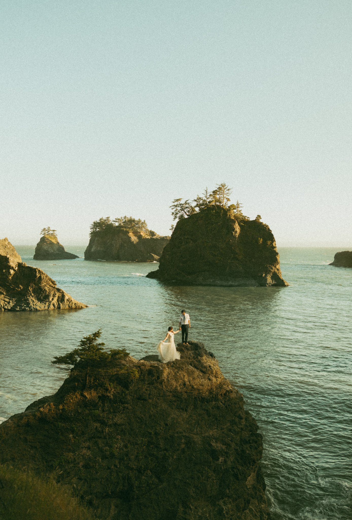 couple on coastal cliff on Oregon coast
