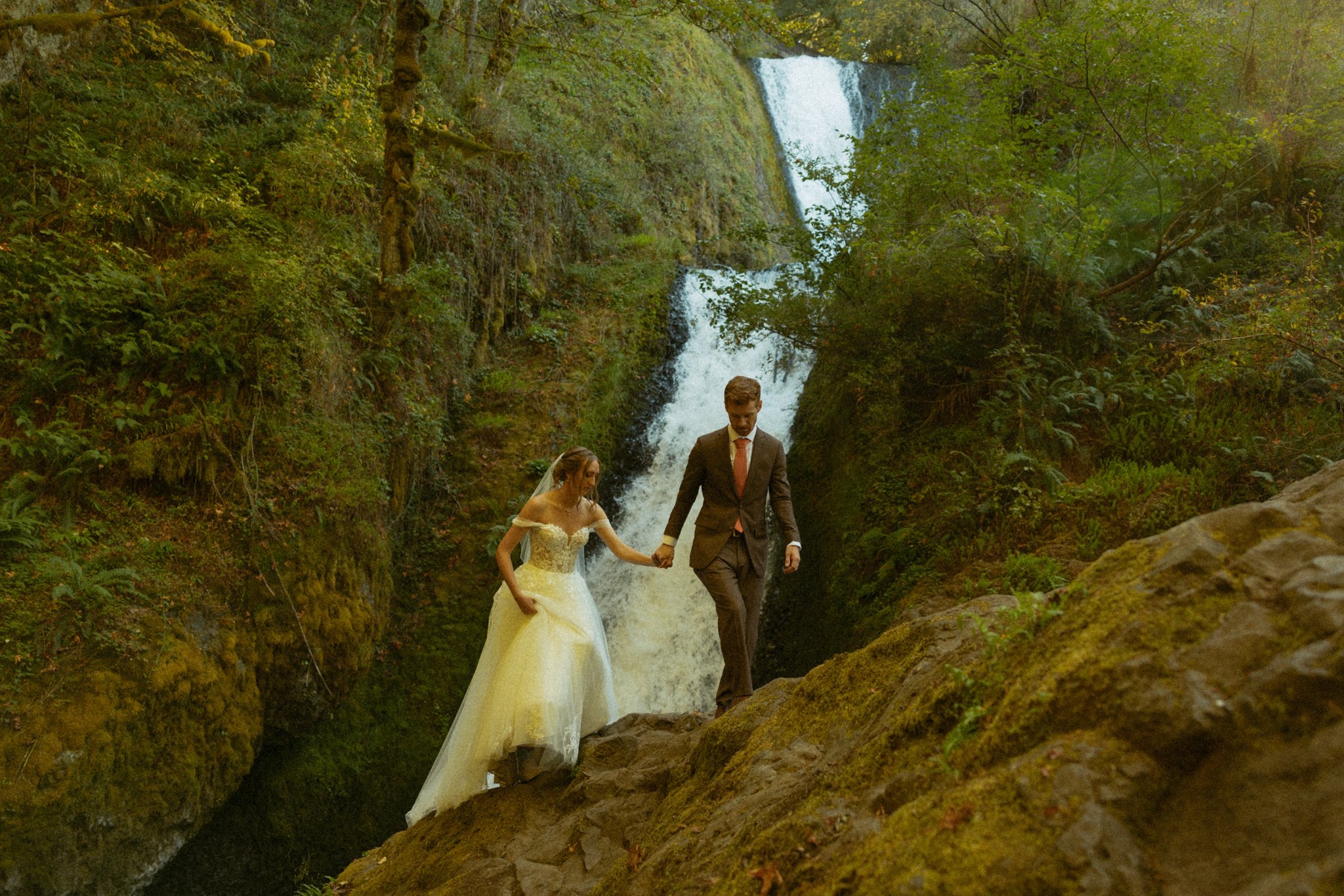 couple eloping among an Oregon waterfall